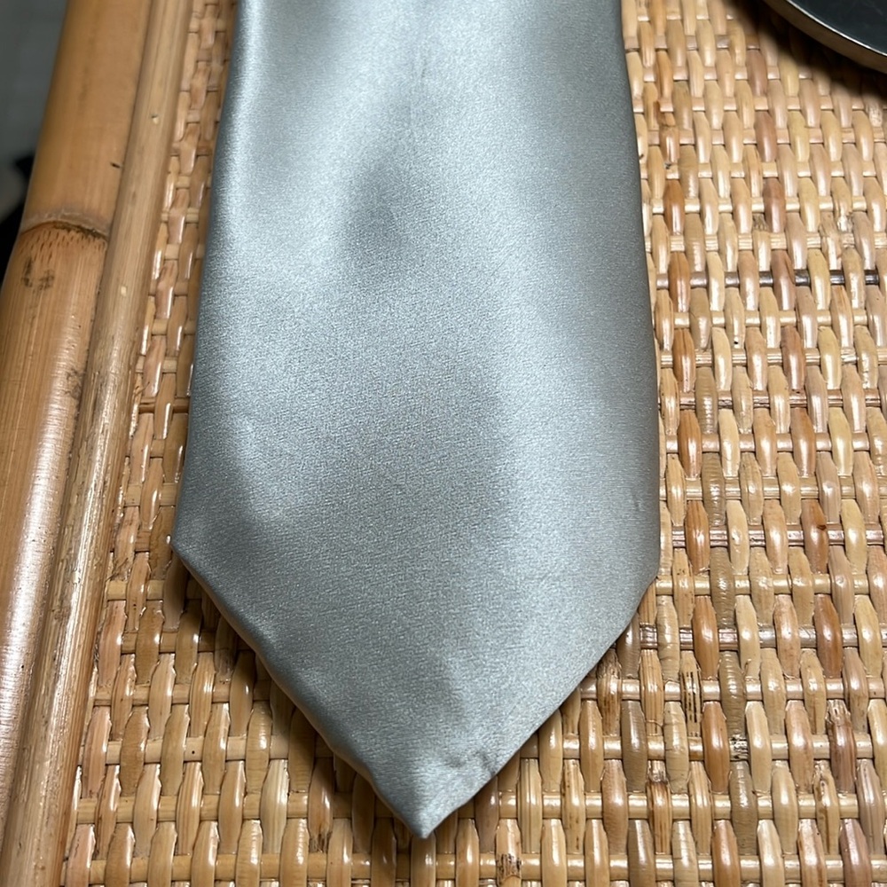 Grey or silver silk tie. No label